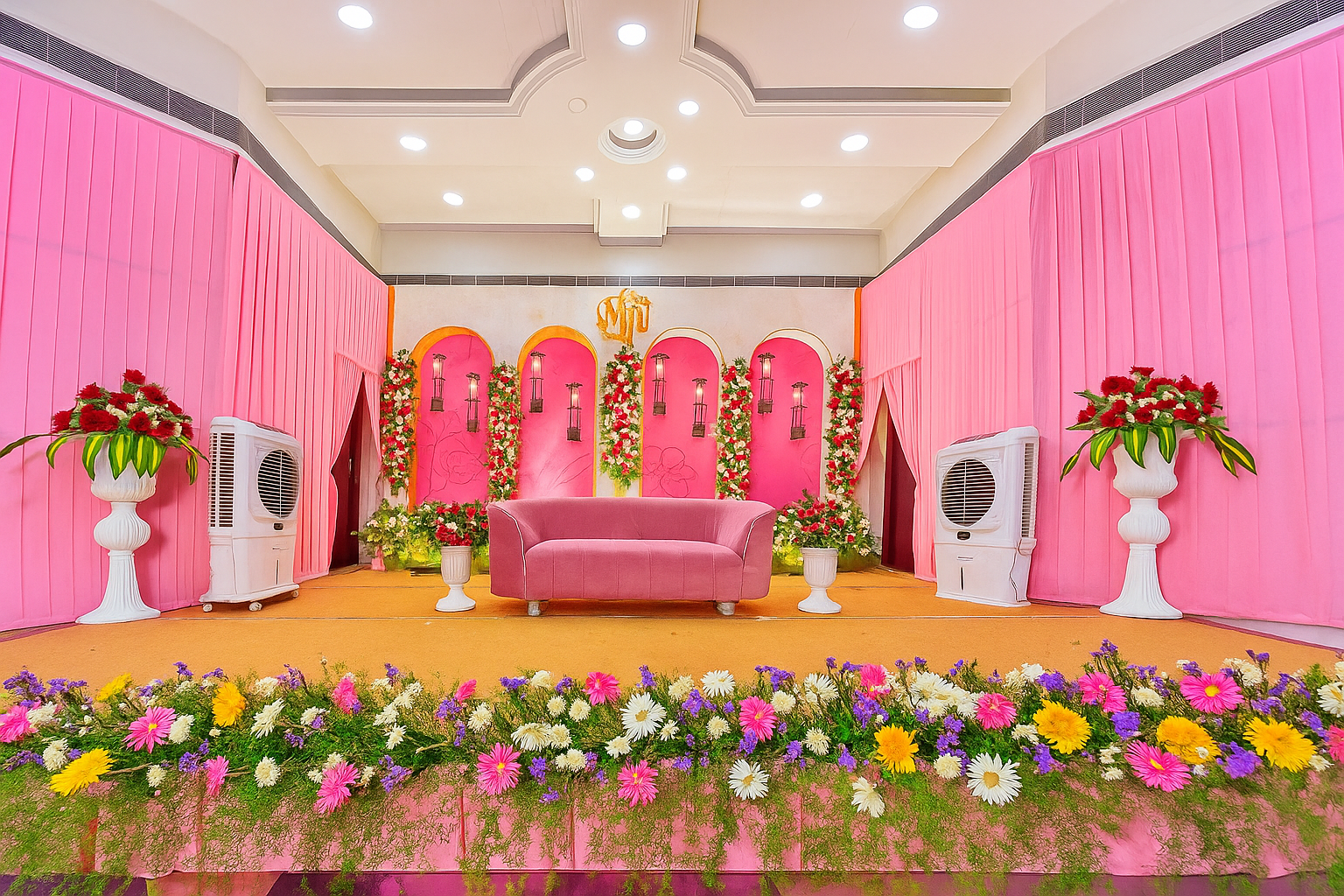 Elegant wedding hall setup at Sri Balakashi Mahal With Flowers And Pink Colors